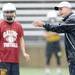 Saline High School football head coach Joe Palka instructs a player during practice in the rain at the school on Monday, August 12, 2013. Melanie Maxwell | AnnArbor.com